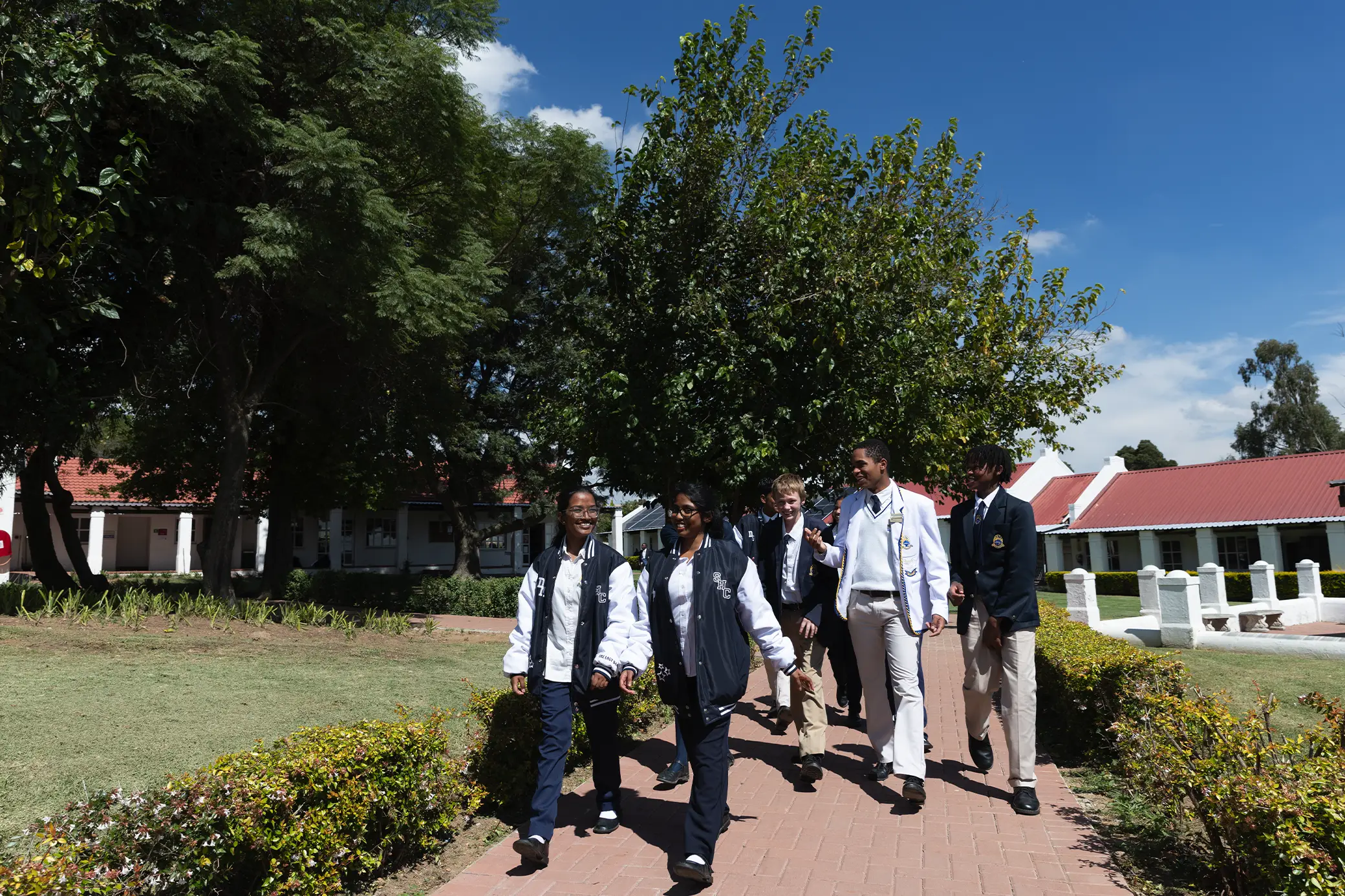 Students walking on the Summerhill campus grounds